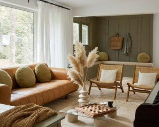 Image may contain Furniture Table Living Room Room Indoors Chair Coffee Table Home Decor Couch and Interior Design