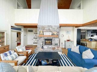 Image may contain Living Room Room Indoors Furniture Housing Building Couch Interior Design Rug and Table